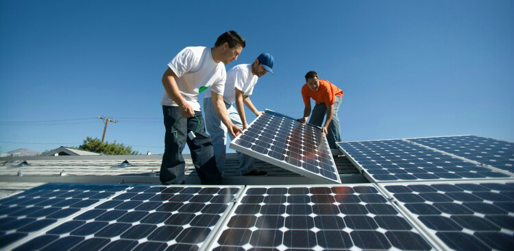 professionals installing solar panels